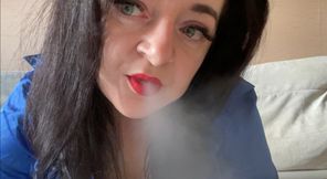 Hot Mistress Lara sexually smokes in camera and shows her big boobs