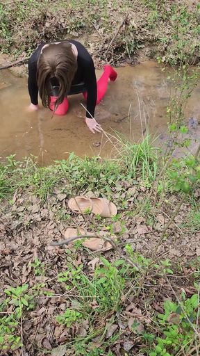 Must-see moment from &quot;Crossdressed outdoors playing in a stream. Wearing pantyhose and miniskirt.&quot;
