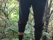 A young guy studies himself in nature