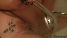 Emo Emily Rubbing shower on her pussy