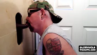 Guy sucks big dick through glory hole and takes cumshot