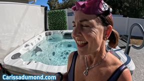 Carissa in the purple neoprene bathing suit in the hot tub with mask