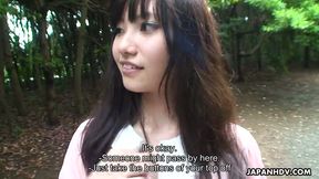 Riko Tanabe gives a quick blowjob to her boyfriend in a forest