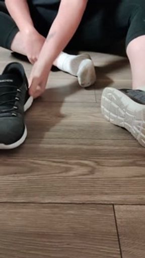 Removing dirty white ankle socks from my dirty and sweaty feet