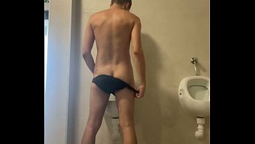 Dared his flatmate to expose his hot smooth butt at the pool'_s public toilets urinal