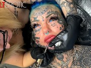 Australian bombshell Amber Luke gets a new chin tattoo