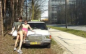 Nasty lady in full action outdoor at my taxi car