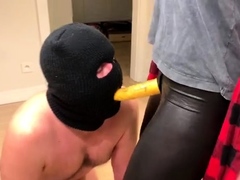 Milf mistress makes masked slave worship strapon dildo