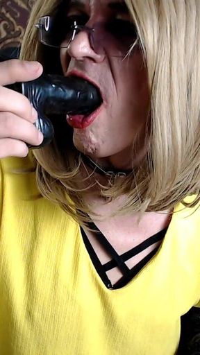 Sucking the Black Dildo