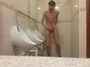 Very skinny teen masturbates in public bathroom urinal