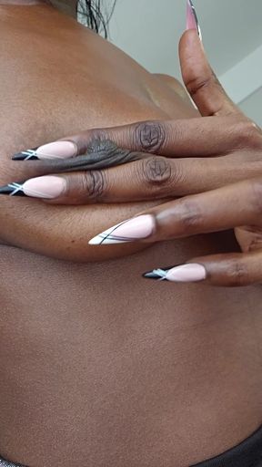 Black woman with long nails and black hair