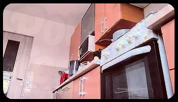 Sultry Brunette Wife Seduces in the Kitchen with Natural Curves