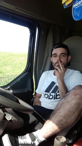 Jerking off in Shorts in a Parked Truck and Smoking a Cigarette