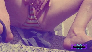 Pissing in shorts on the stairs and having wet panties