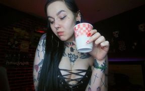 Sexy Alternative Brunette Drinking Sparkling Water and Burping