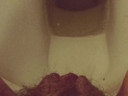 Close-up hairy pussy pissing  on public toilet after holding