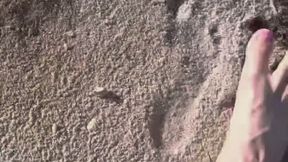 Comparing Size 16 Feet to Sand Prints at the Beach