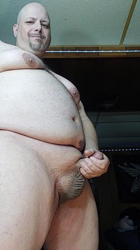 Chubby Guy Stands and Cums