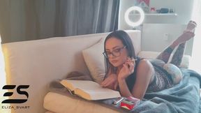 Relaxing barefoot smoking while reading a book