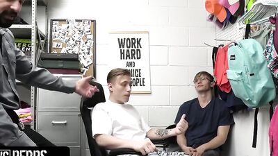 Hunky security officer catches two thieving twinks and fucks them