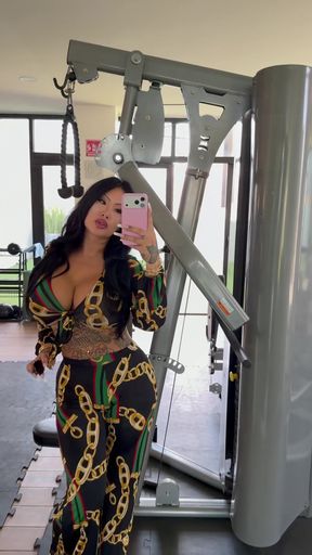 Female fitness model in gym attire