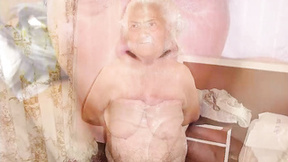 Grandma squeezes her giant breasts with big nipples