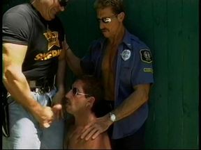 Two horny jacked gay cops and a hot perp get some sucking outside