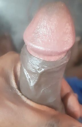 A south asian young man is indulging in self-pleasure at his residence.