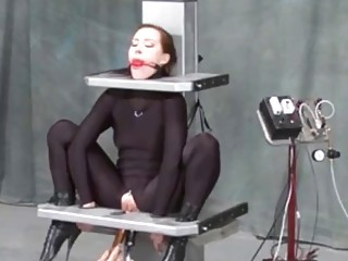 Submissive girl enjoys bondage and BDSM treatment on a machine