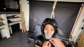 Rey bound and gagged in a shiny Downjacket and Leatherpants