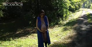 Pregnant Lena showing her boobs in the forest