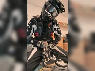 Homosexual motocross rider jerks off and cums on his trainers