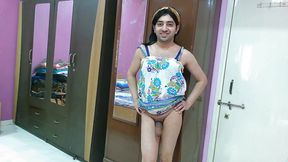 Hot sissy crossdresser femboy in beach dress and hairband.