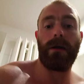 Muscular fitness bodybuilder is cleaning body taking shower and doing muscle worship