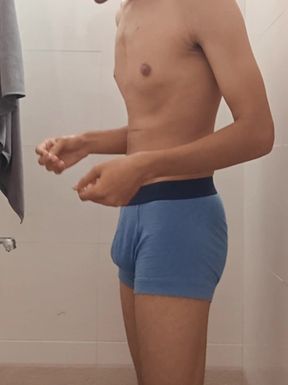 Teen indian boy taking shower