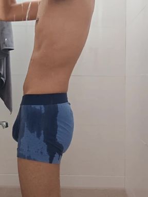 Teen indian boy taking shower