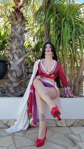 Curvy blonde anime character poses in Mistress costume showing off