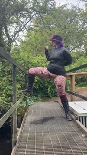 Milf pees on public walking bridge into water