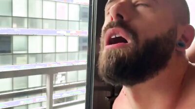 Bearded man polishes that sausage and gets a messy facial