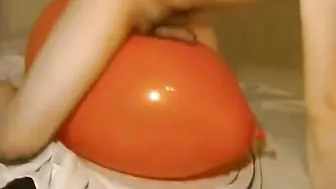 Twink humps big inflatable orange balloon until he cums