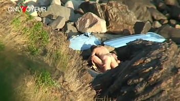 Redheaded couple caught having a horny fuck on the beach