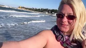 Topless MILF pisses on public beach while jogging