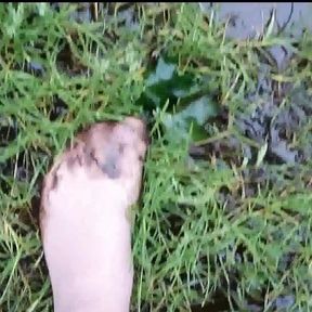 Nylon feet have fun in the dirty puddle