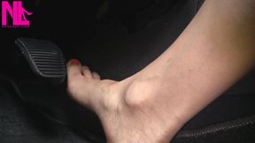 Nyllady with Her Bare Foot on Gas Pedal Driving