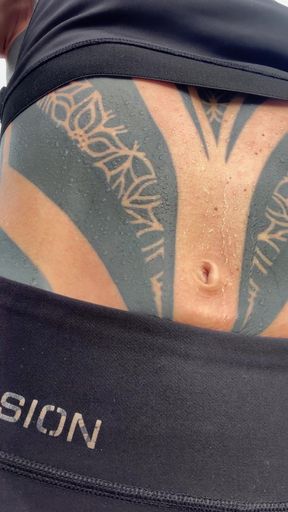 Athletic fit black chick chows off sweaty tattooed tatt and gets it