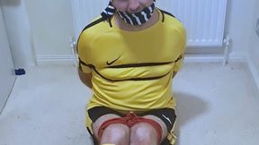 Miss M and a footballer in yellow and black kit struggling to get out of tight bondage