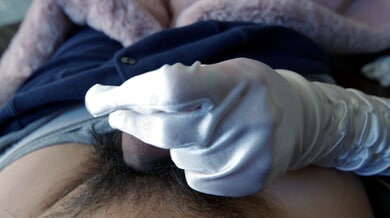 White-gloved handjob builds to a powerful cumshot