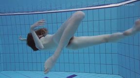 Tiny young Anna gets moist in a poolside solo scene