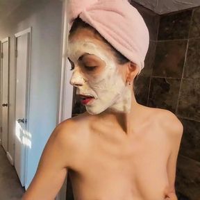 Masturbation in the bathtub with mud mask on the face