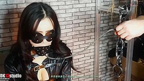 Pretty Asian Pump Gagged In Leather Straightjacket